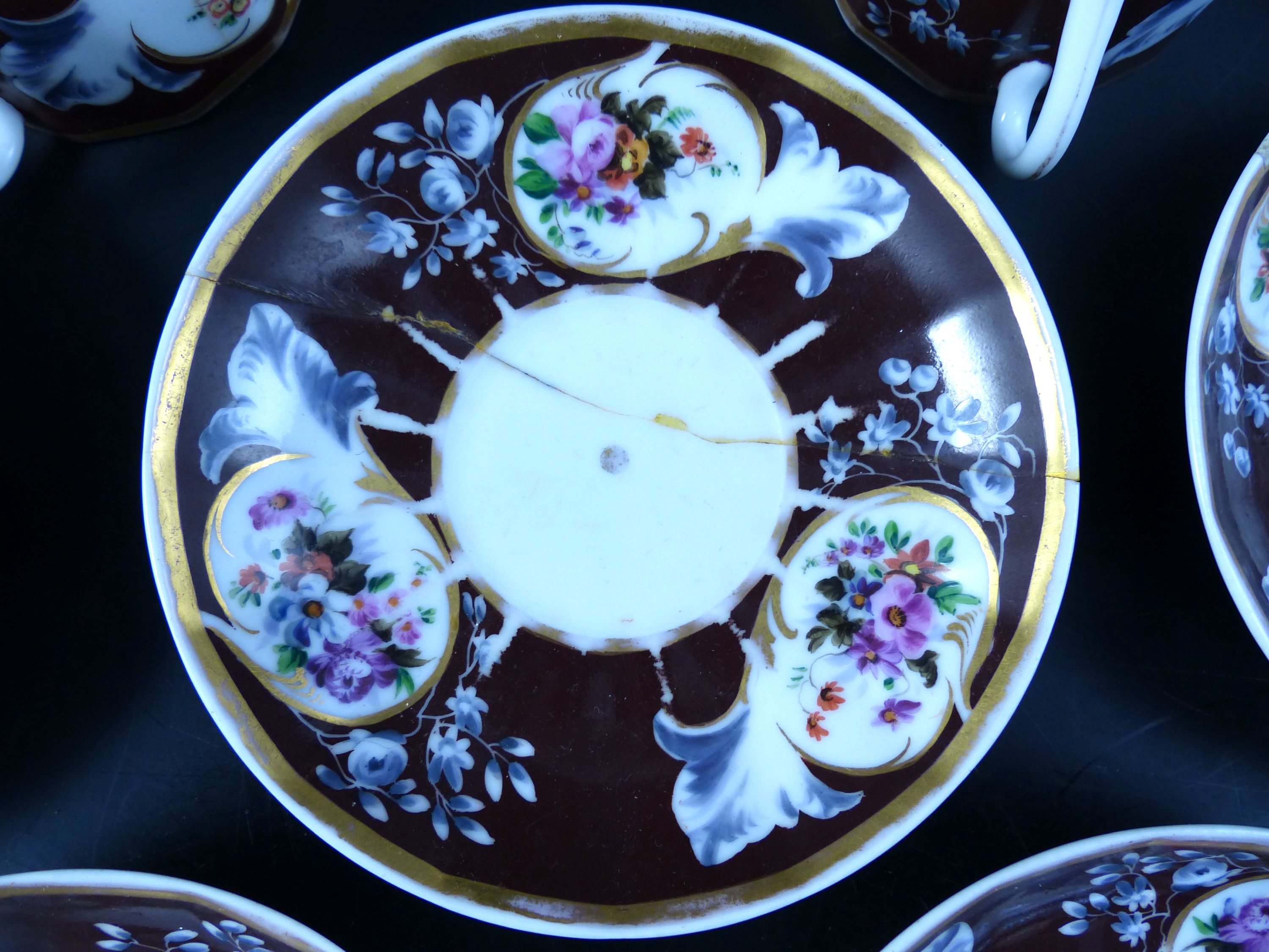 A set of seven Continental porcelain tea cups and saucers